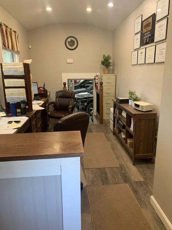 Front office at Steve's Auto Body in Norwell, MA with I-CAR Gold Class certifications on the wall